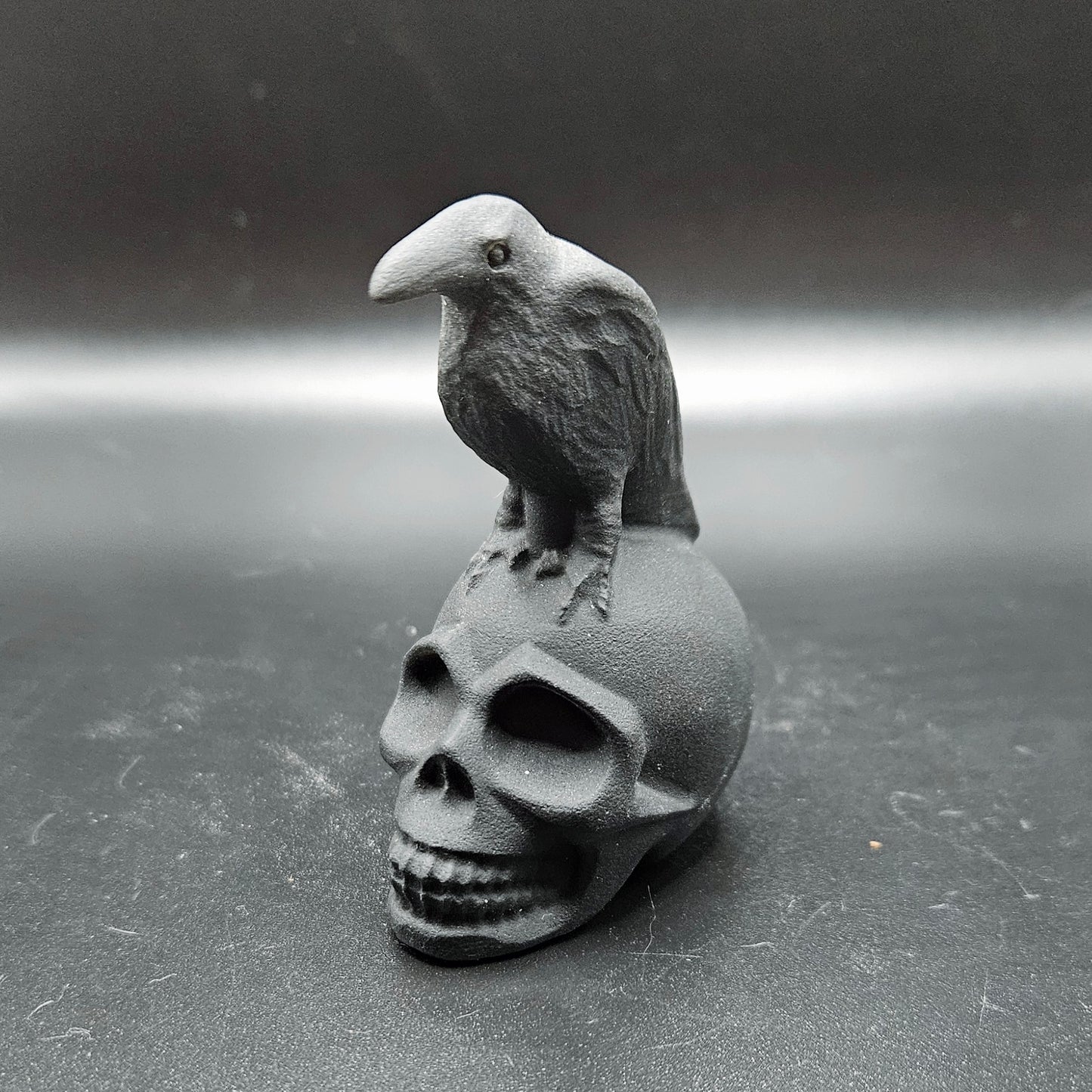 Obsidian crow on skull