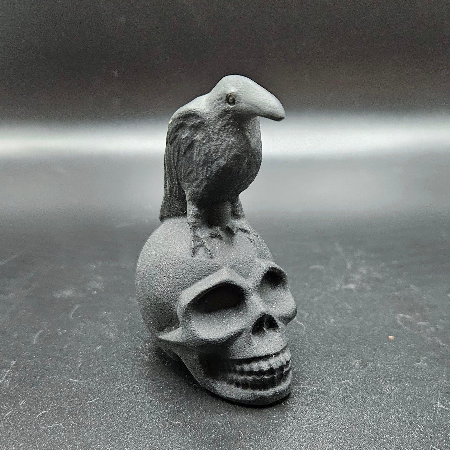 Obsidian crow on skull